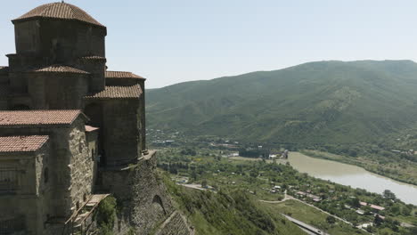 Flying-By-The-Jvari-Monastery,-Georgian-Orthodox-Monastery-On-Mountaintop-Overlooking-Mtkvari-And-Aragvi-River-Confluence-In-Mtskheta,-Georgia