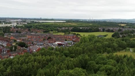 Residential-homes-aerial-view-suburban-British-town-woodland-neighbourhood-countryside