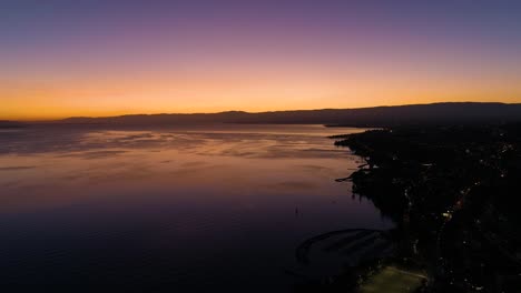 Hyperlapse-along-the-shore-of-Lake-Léman-with-beautiful-sunset-colors-Lutry,-Lavaux---Switzerland