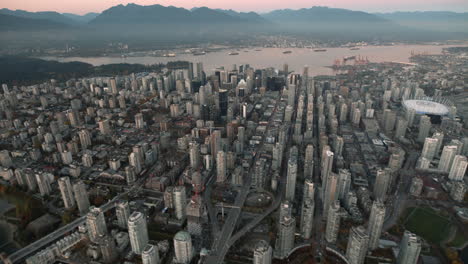 Aerial-wide-shot-of-Granville-street-and-Downtown-Vancouver,-Dusk