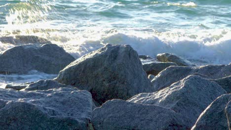 Ocean-waves-splashing-up-against-rocks-in-South-Florida-beach-coast-landscape