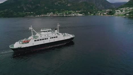 Aerial-Slomo-Panning-around-a-Norwegian-Ferry-entering-a-Small-Village