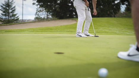 Golfer-sinking-a-hole-in-one-and-celebrating-in-slow-motion