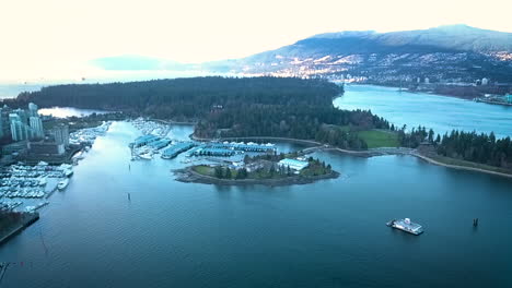 Beautiful-drone-shot-of-a-lakeside-city-and-mountain-range