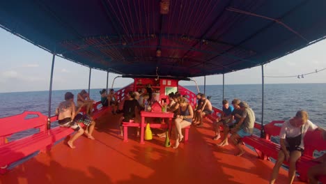 Tourists-on-a-large-wooden-boat-in-Koh-Tao,-Thailand