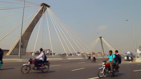 Traffic-on-the-modern-designed-flyover,-Mostly-bikers-passing-without-helmets