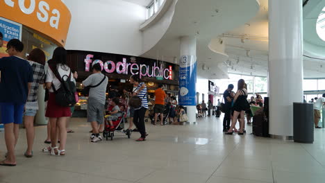 Singapore---Circa-Time-Lapse-crowds-of-people-move-through-a-crowded-shopping-mall,-Singapore