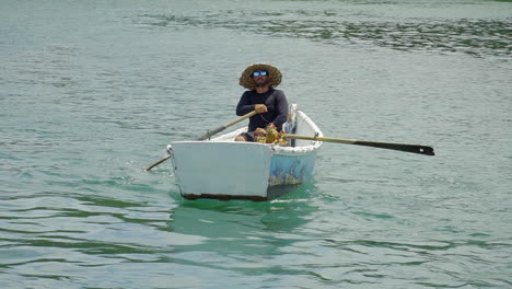 Shot-of-Local-selling-pinacoladas-on-small-boats---Buzios---Rio-De-Janeiro