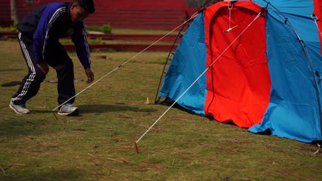 Tent-pitching-by-Himalayan-mountaineers-for-their-stay-in-upper-Himalayas-snowy-peaks