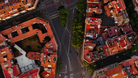 Aerial-zenital-view-of-square-blocks-in-new-quarter-of-Barcelona-at-sunrise,-Spain