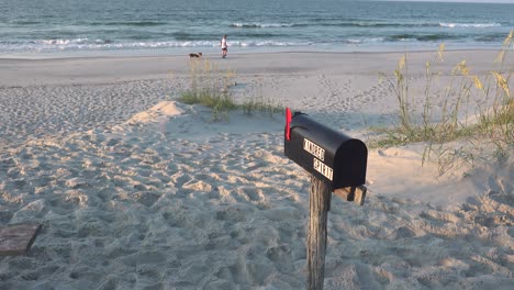 The-Kindred-Spirit-mailbox-on-Bird-Island,-just-south-of-Sunset-Beach-NC,-where-people-can-leave-comments-about-their-life-journey-and-read-what-others-have-written