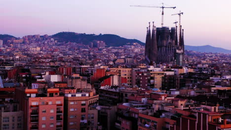 Cityscape-of-Sagrada-Familia-and-the-city-at-sunrise,-Spain