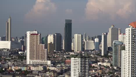 Meidum-shot-of-some-Bangkok-city-skyscrapers-on-cloudy-day-in-Thailand