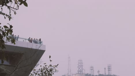 A-time-lapse-of-people-visiting-the-viewpoint-a-The-Peak-Tower-at-the-top-of-Hong-Kong-Island,-China