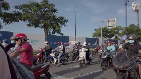 Early-morning-stabilized-POV-shot-in-4k-60fps-of-Motor-scooter-traffic-on-the-streets-of-Ho-Chi-Minh-City-Vietnam