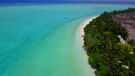 Harbor-Island,-Bahamas---Famous-Tropical-Island-Surrounded-By-White-Sand-and-Green-Trees---Beautiful-Calm-Ocean---Aerial-Shot