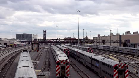 passenger-train-leaving-rail-yard-overhead-view-4k
