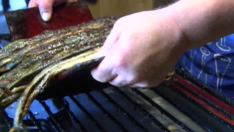 Roasting-of-a-lamprey-on-a-large-rack
