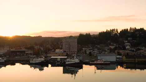 Coos-Bay-Oregon-shoreline,-drone-flys-parallel-to-Highway-101-and-Tioga-Hotel