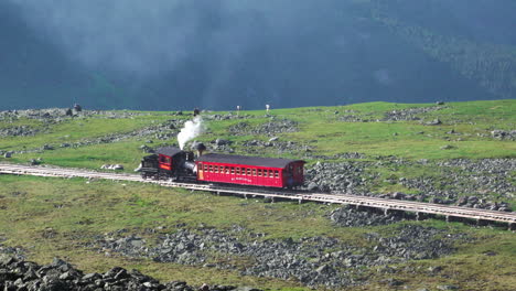 Conway,-Newhampshire---July-4,-2019:-A-train-car-load-of-tourists-on-the-cog-railway-on-Mount-Washington-in-Conway,-Newhampshire-on-july-4,-2019