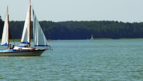 two-masted-Yacht-sailing-in-Wdzydze-Lake-in-Kaszubski-park-krajobrazowy-in-Pomeranian-Voivodeship