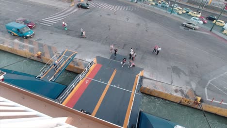 Tourists-boarding-on-a-commercial-ship-in-Piraeus-port-during-summer-in-slow-motion
