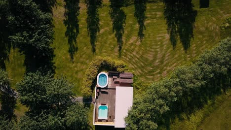 Drone-shots-of-of-a-country-side-cabin-with-hot-tubs