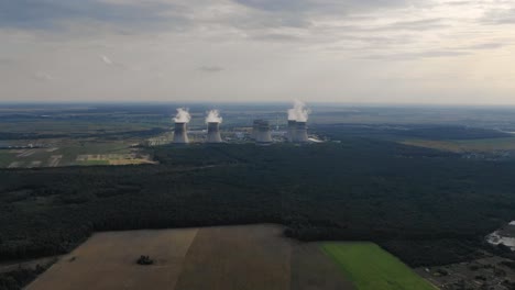 Wide-Aerial-View-of-Modern-Nuclear-Power-Plant-Surrounded-by-Vast-Forest-in-Ukraine