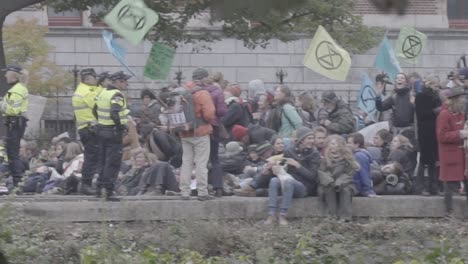 Young-protesters-blockade-street-at-extinction-rebellion-protest-in-Amsterdam-at-rijksmuseum
