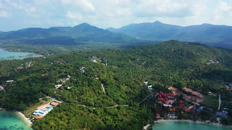 Beautiful-tropical-island-with-lush-vegetation-hills-with-rocky-coastline-washed-by-calm-clear-water-of-turquoise-sea,-ko-phangan,-Thailand