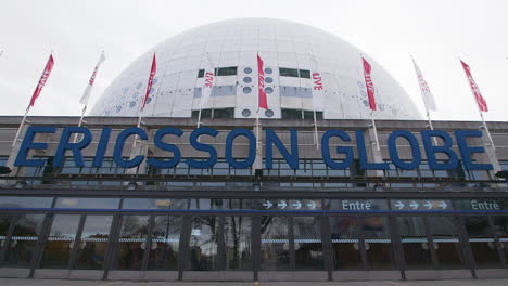 Entrance-of-Stockholm-Ericsson-Globe,-tilt-down-from-sky