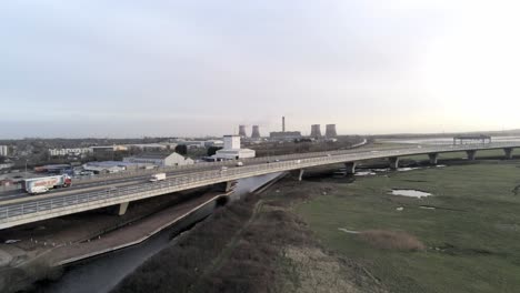 Aerial-view-of-traffic-vehicles-on-Mersey-gateway-motorway-landmark-bridge-crossing---regeneration-infrastructure