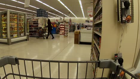 POV-from-the-shopping-cart-while-going-past-the-poultry-cooler-at-the-grocery-store