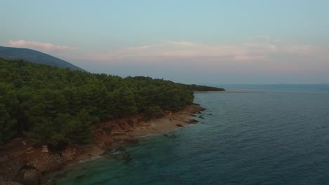 Remote-beach-and-shoreline-with-clear-warm-turquoise-water-of-the-Adriatic-surrounding-islands-of-Croatia