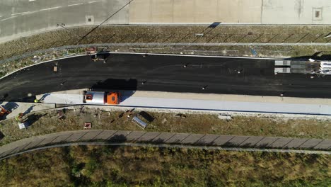 Top-down-wide-aerial-view-of-a-road-under-construction