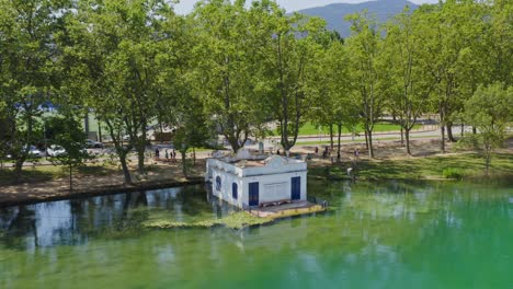 Aerial-view-of-the-famous-boat-house-along-the-shores-of-Lake-Banyoles-in-Catalonia-Spain