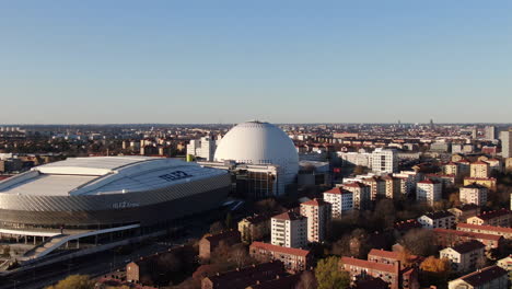 Aerial-dolly-zoom-of-Ericsson-Globe-and-tele2-arena-on-bright-fall-day