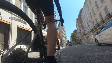 Legs-Of-Male-In-Trainers-Cycling-Down-Street-During-Lockdown-In-London