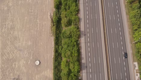 M50-Motorway-In-Dublin,-Ireland-With-Nearby-Land-Area-Ready-For-Construction---aerial-shot