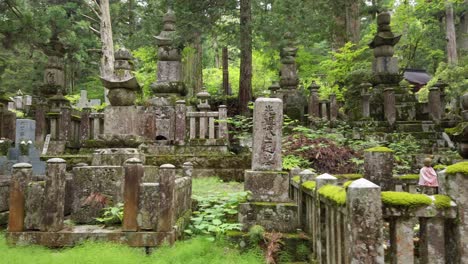 Gimbal-Walk-through-the-Old-historical-Cemetery-Oku-no-In-with-tombstones,-located-in-Koyasan---a-small-town-in-Japans-prefecture-Wakayama