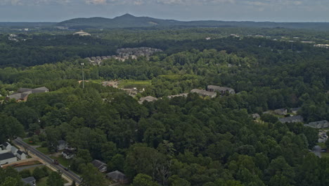 Woodstock-Georgia-Aerial-v4-pan-right-shot-of-calm-neighborhood,-wild-forest-and-hills---DJI-Inspire-2,-X7,-6k---August-2020