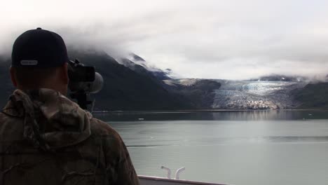 Photographer,-taking-pictures-of-a-glacier,-from-a-boat,-in-Glacier-Bay-National-Park,-Alaska