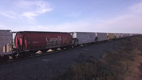 Creative-cinemagraph-of-CP-Rail-train-on-tracks,-only-the-shadow-moves