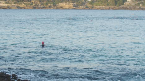 Person-Swimming-in-Ocean-at-North-Bondi-Beach-in-Sydney,-Australia