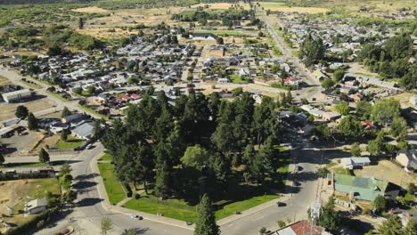 Aerial-high-angle-of-a-pine-tree-octagonal-square-at-the-center-of-Trevelin-town,-Patagonia-Argentina