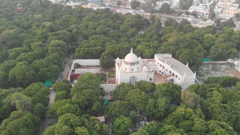 Aerial-Over-Mosque-Surrounded-By-Green-Trees-In-Karachi