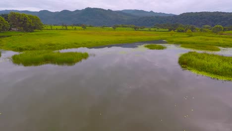 Aerial-view-from-drone-of-the-El-Porvenir-lagoon-in-cloudy-afternoon,-rural-area-of-Córdoba,-Veracruz,-Mexico