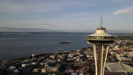 Slow-clockwise-aerial-orbit-of-the-iconic-Seattle-Space-Needle-and-Puget-Sound