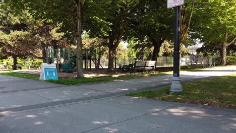 Aerial-eye-level-hold-at-empty-Lockdown-pandemic-restricted-park-with-laws-of-f-2-meters-or-6-feet-apart-social-distancing-in-Downtown-Vancouver-Park-by-ocean-at-Granville-Island-Canada-BC-2-2