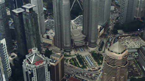 Tilting-Aerial-Shot-Of-Skyline-And-City-Streets-In-Kuala-Lumper,-Beautiful-Travel-Destination